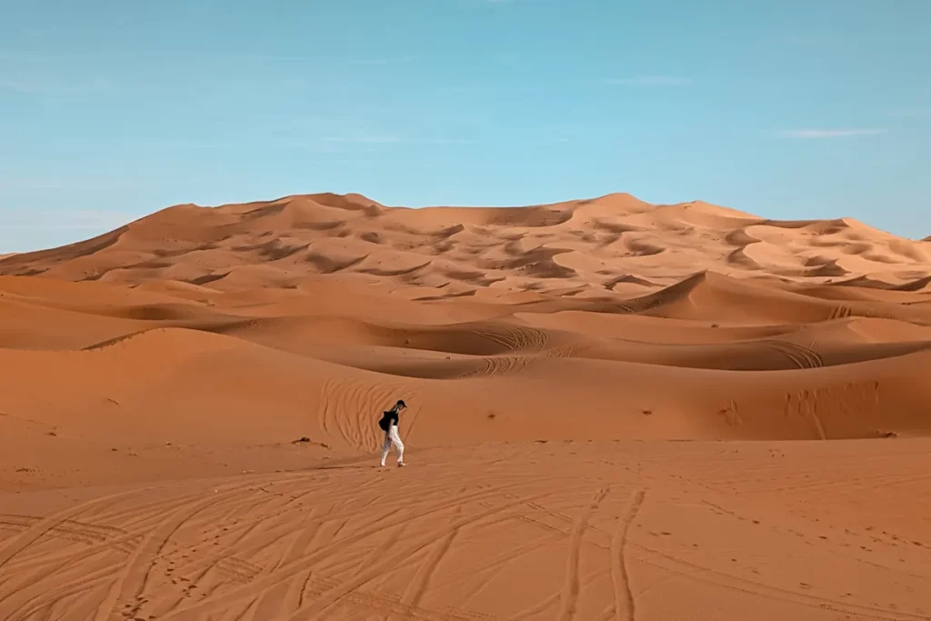 Exploring the dunes of Erg Chebbi from our Sahara desert camp