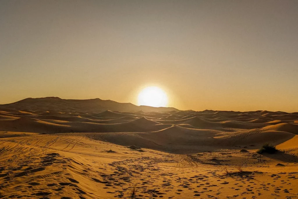 Sunrise over the dunes of the Sahara desert from our camp